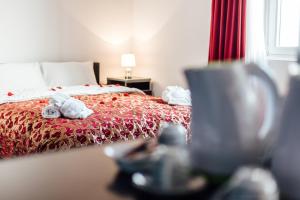 Postel nebo postele na pokoji v ubytování Hotel Azzurro