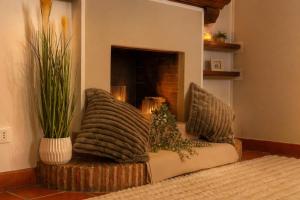 a living room with a couch and a fireplace at Marconi Home in Trieste