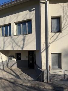 a building with a shadow on the side of it at Ekoviki2 in Kranj +4 photos