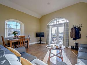 a living room with a couch and a table at 2 Bed in Hawick oc-86021 in Hawick