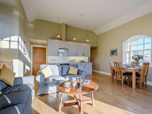 a living room with a couch and a table at 2 Bed in Hawick oc-86021 in Hawick +17 photos