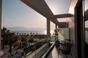a balcony with a view of the ocean at Padma Hotel in Vlorë