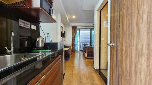 a kitchen with a sink and a counter top at Smyrna in Pattaya