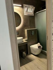 a bathroom with a toilet and a sink at Luxury Villa Vista in Tsouknída +40 photos