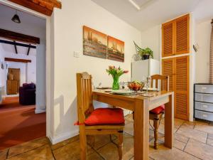 a dining room with a wooden table and chairs at 1 Bed in Penrith oc-90417 in Kirkoswald