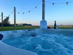 a jacuzzi tub with a view of a field at 2 Bed in Ormskirk oc-90263 in Barton