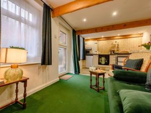 a living room with a couch and a table at 1 Bed in Penrith oc-90416 in Kirkoswald