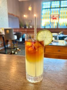 a drink with a lime slice on a table at The Lion Hotel in Builth Wells
