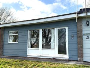 a house with a white window on it at 51 Norton Park in Dartmouth +5 photos