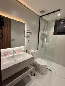 a bathroom with a sink and a toilet and a shower at توليب حتا 2 Tulip Hatta in Al Khobar +23 photos