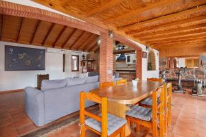 a living room with a table and a couch at Las Casitas 28 in Corralejo