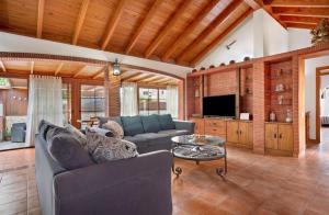 a living room with a couch and a table at Las Casitas 28 in Corralejo