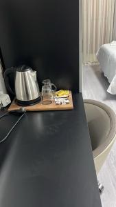 a kitchen counter with a tea kettle on a table at Retro Boutique in Istanbul +16 photos
