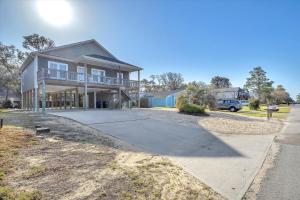a large house with a driveway in front of it at All Summer Long by Oak Island Accommodations in Oak Island