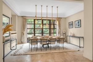 a dining room with a table and chairs at Villa Socar - Heated pool - Padel - Marrakech in Najem