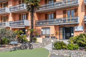 a building with two bikes parked in front of it at Park Hotel Faver in Tremosine Sul Garda