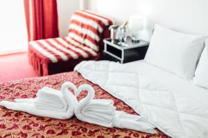 Postel nebo postele na pokoji v ubytování Hotel Azzurro