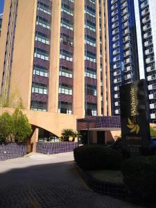 a large building with tall buildings in the background at 1601 - Hotel & Residence Sol Alphaville Flat in Barueri
