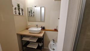a bathroom with a sink and a toilet at Monte Ricco Appartamenti in Monselice +10 photos