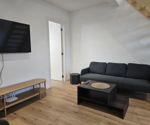 a living room with a couch and a coffee table at Atomium Apartment 2 in Brussels