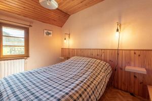 a bedroom with a bed in the corner of a room at Gîte de la Séoube in Campan