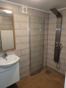 a bathroom with a shower and a sink at Yellow house in Skene +16 photos
