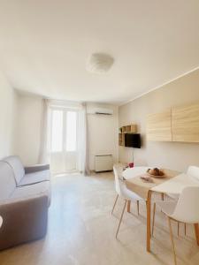 a living room with a couch and a table at Scabi Apartments in Trapani