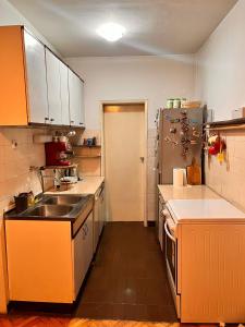 a small kitchen with a sink and a refrigerator at Apartment 16 in Probištip