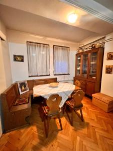 a dining room with a table and chairs in a room at Apartment 16 in Probištip