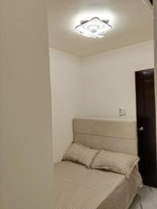 a bedroom with a bed and a ceiling at Home stay in Pasig in Pasig