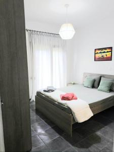 a bedroom with a large bed in a room at Seawaves in Ierissos