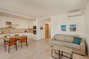 a living room with a couch and a table at River side apartment B17 in Herceg-Novi