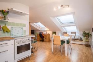 a kitchen and dining room with skylights at Adlerblick in Wangen +11 photos