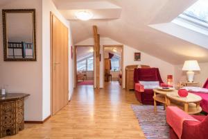 a living room with a couch and a table at Adlerblick in Wangen