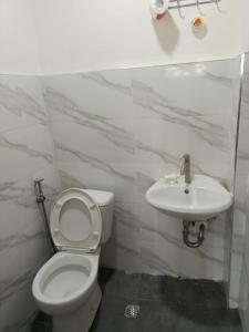 a bathroom with a toilet and a sink at Home stay in Pasig in Pasig +26 photos