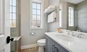 a white bathroom with a sink and a toilet at The Sono Chicago in Chicago +49 photos