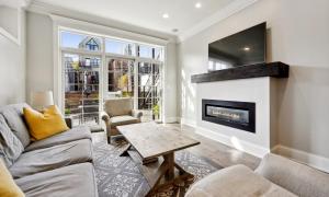 a living room with a couch and a fireplace at The Sono Chicago in Chicago