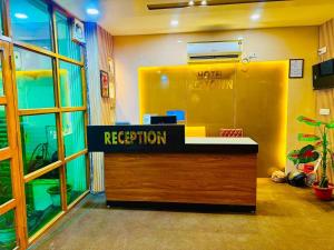 an office with a reception desk in a room at Hotel Keptown in Patna