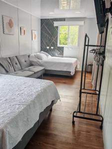 a living room with two beds and a couch at Tierra de Gosén in Santa Cruz +36 photos