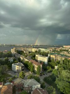 a city with a rainbow in the background at Delmar Apartment Center in Dnipro