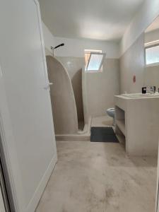 a bathroom with a sink and a shower and a toilet at John's Guesthouse in Ksamil +195 photos