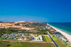 an aerial view of a resort on the beach at Polaris Resort & Spa in Xóm Tram