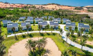 an aerial view of a large house with palm trees at Polaris Resort & Spa in Xóm Tram