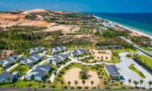 an aerial view of a resort near the beach at Polaris Resort & Spa in Xóm Tram +96 photos