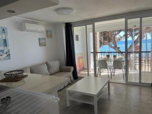 a living room with a couch and a table at Volver in Mijas Costa