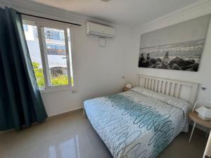 a bedroom with a bed and a window at Volver in Mijas Costa +19 photos