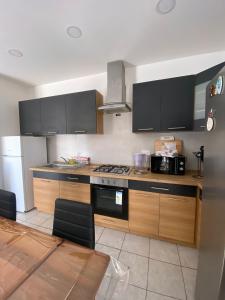 a kitchen with a stove and a microwave at St Julians Mansion Rooms in St. Julianʼs +19 photos