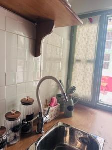 a kitchen sink with a faucet on a counter at La Maisonette de Symi in Symi +16 photos