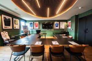 a dining room with a large table and chairs at ibis Styles Castelnaudary in Castelnaudary