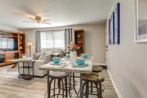 a kitchen and living room with a table and chairs at Tiger Town Retreat: Spacious 3-Home Retreat! in Baton Rouge